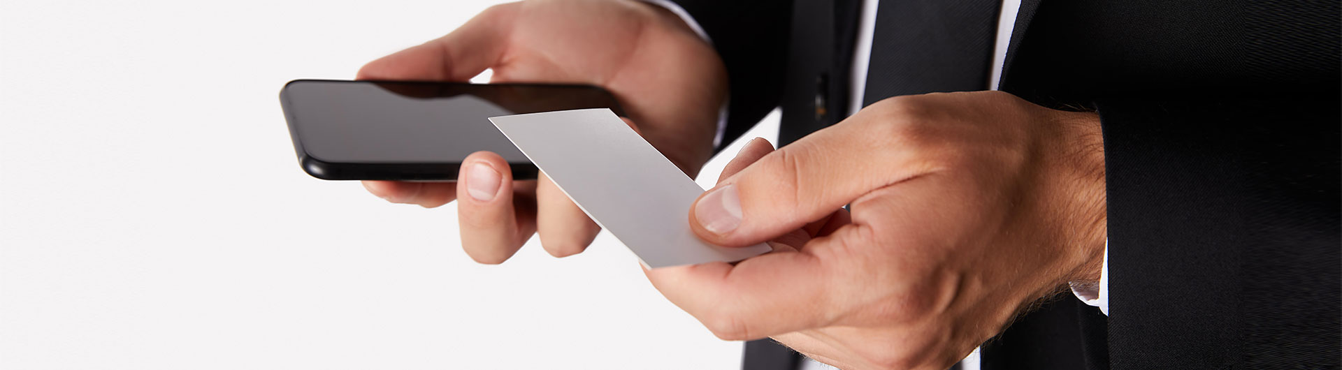 Partial view of businessman holding empty business card