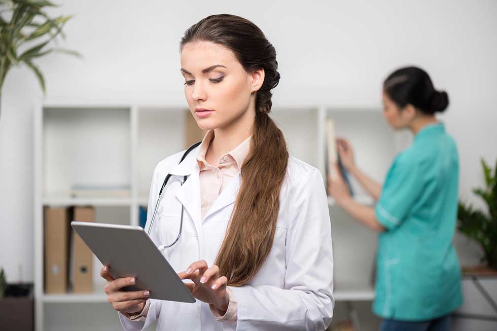 Doctor using digital tablet