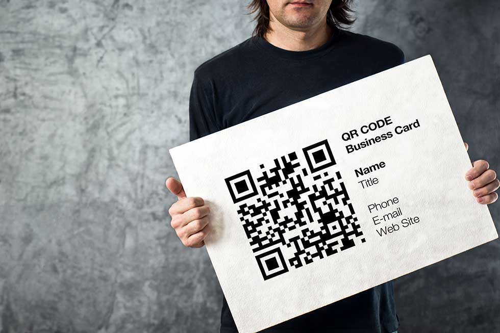 Man holding QR code business card